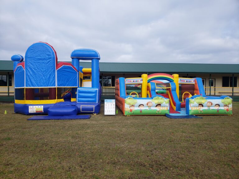 Jumping castle hire Cranbourne with multiple inflatable combos set up for school or community event