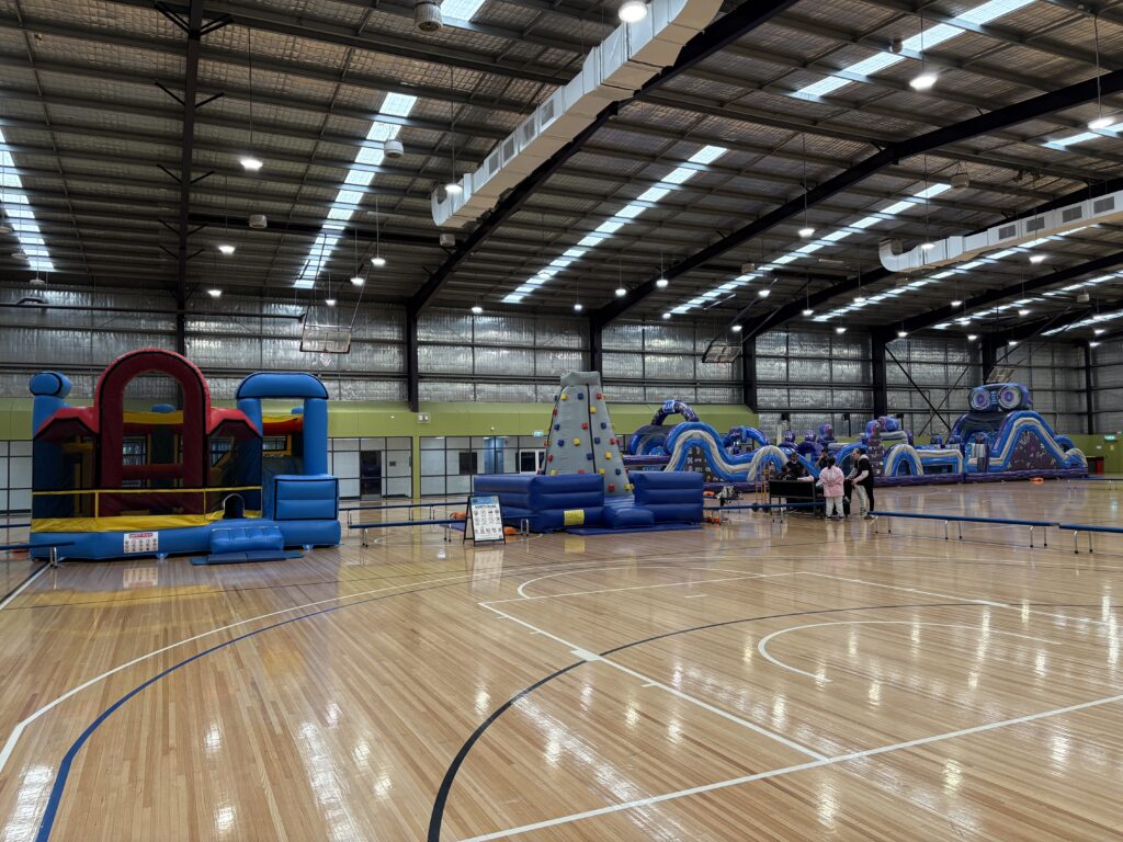 jumping castles and obstacle course hire Nar Nar Goon indoor event setup with party hire equipment