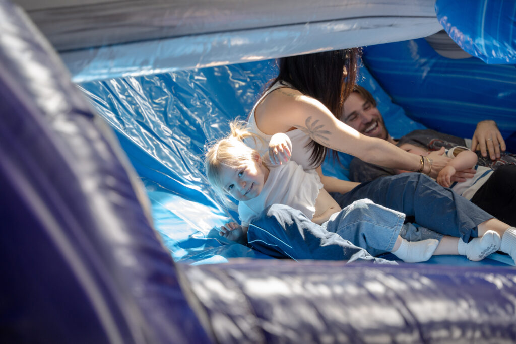 kids and family playing inside jumping castle lang lang party hire
